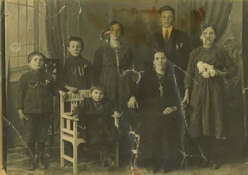 Alfredo Morelli, age 7, is the first child on the left. Seated are his sister and his mother.