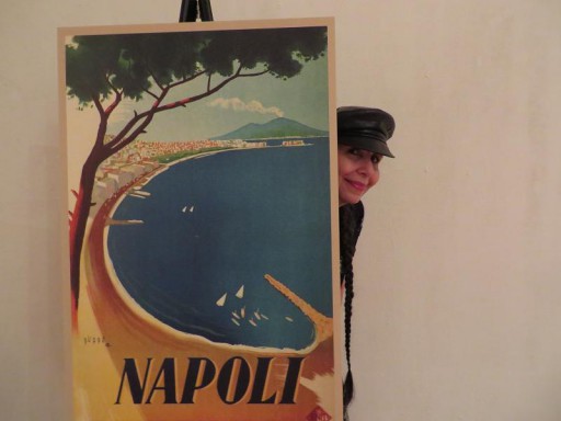 Our journalist LindaAnn LoSchiavo peeking from a Napoli poster at the Ospitalita` Italiana event.